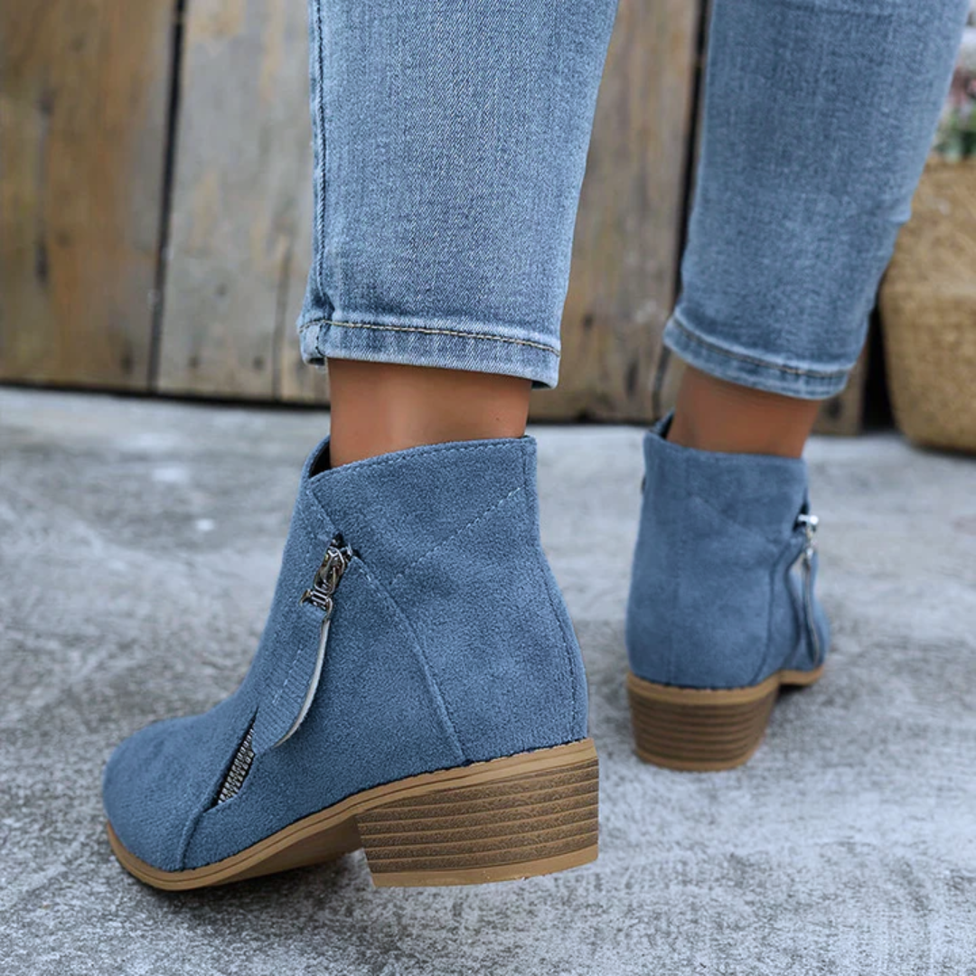 Women's low heel ankle boots worn outdoors
