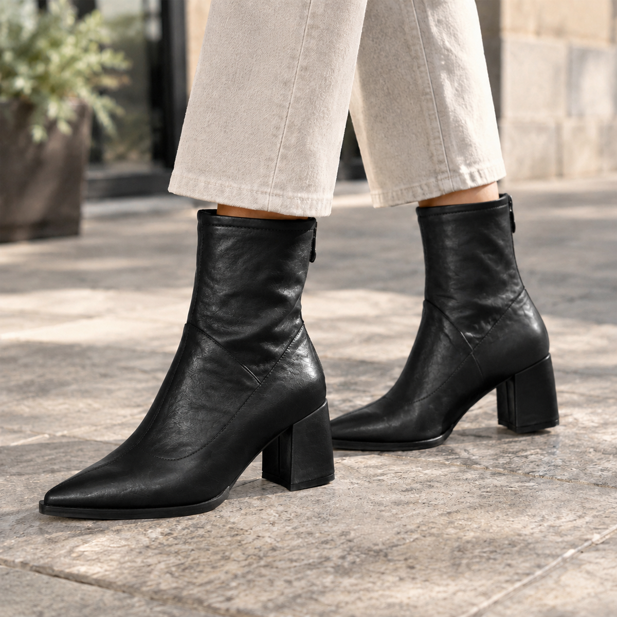 Black pointed toe ankle boots with block heel