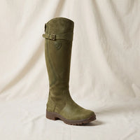 Knee high boots worn with jeans