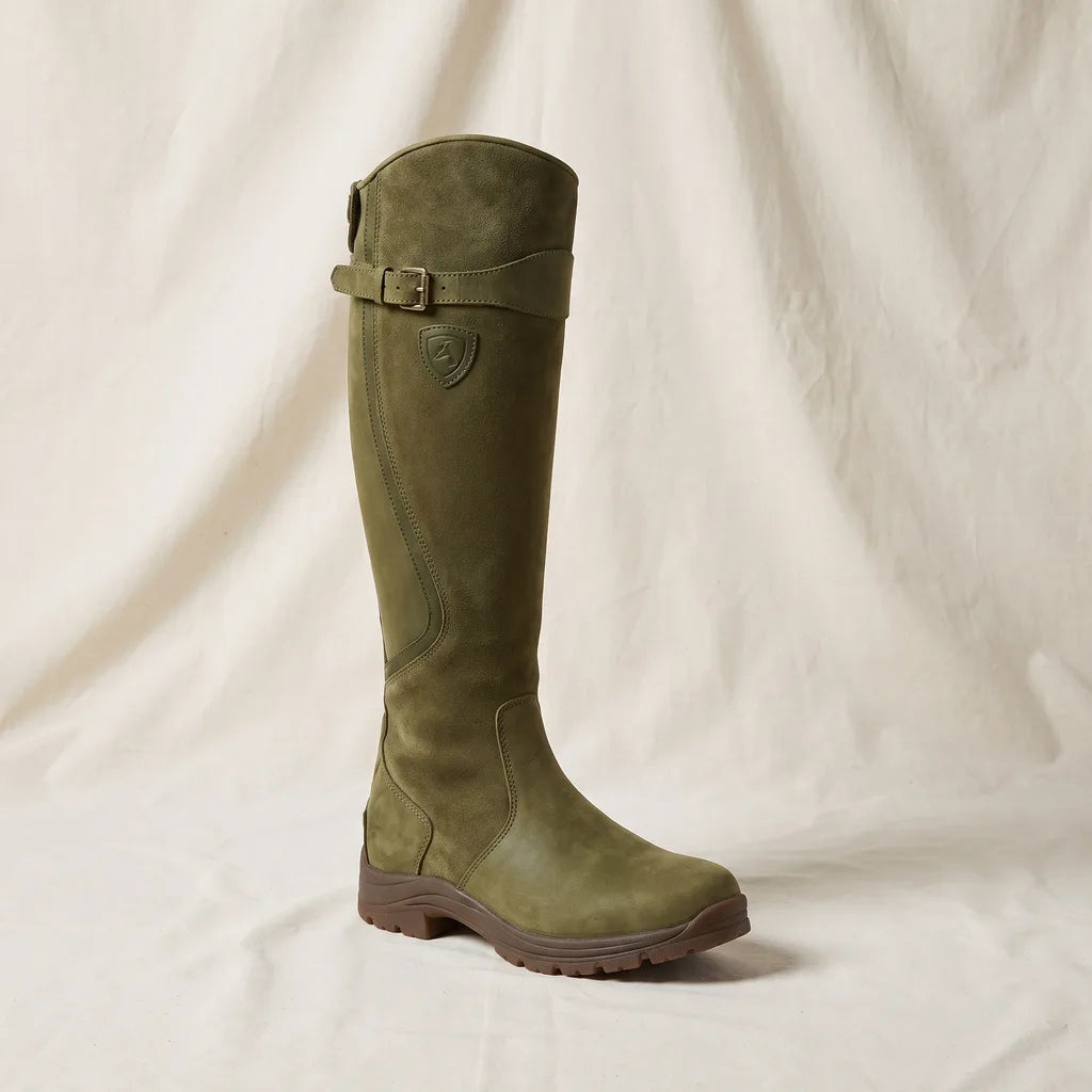 Knee high boots worn with jeans